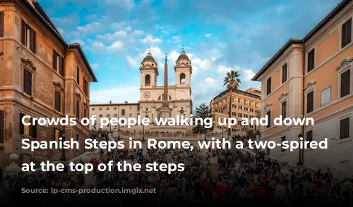 Crowds of people walking up and down the Spanish Steps in Rome, with a two-spired church at the top of the steps