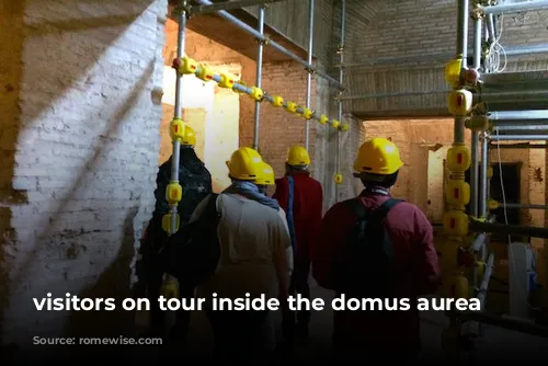 visitors on tour inside the domus aurea