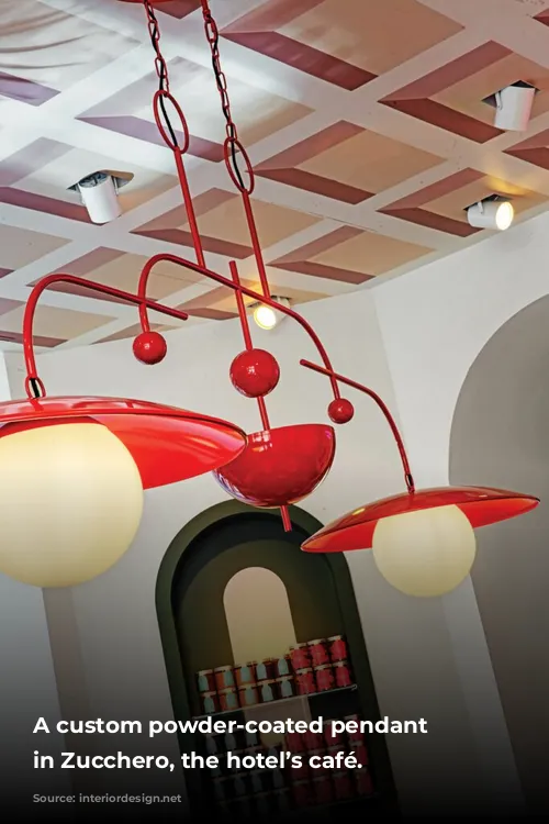 A custom powder-coated pendant fixture in Zucchero, the hotel’s café.