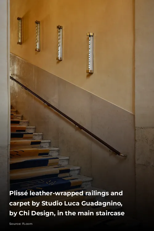 Plissé leather-wrapped railings and custom carpet by Studio Luca Guadagnino, produced by Chi Design, in the main staircase