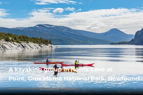  A kayaking group in Norris Cove at Norris Point, Gros Morne National Park, Newfoundland, Canada