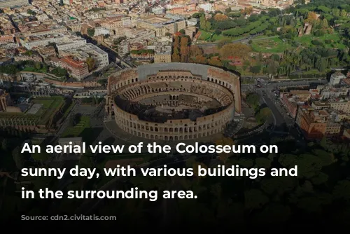 An aerial view of the Colosseum on a sunny day, with various buildings and trees in the surrounding area.