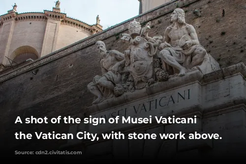 A shot of the sign of Musei Vaticani in the Vatican City, with stone work above.