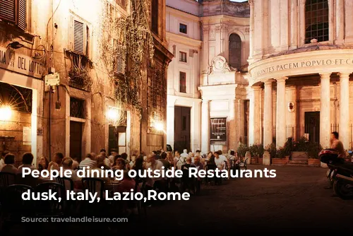 People dining outside Restaurants at dusk, Italy, Lazio,Rome