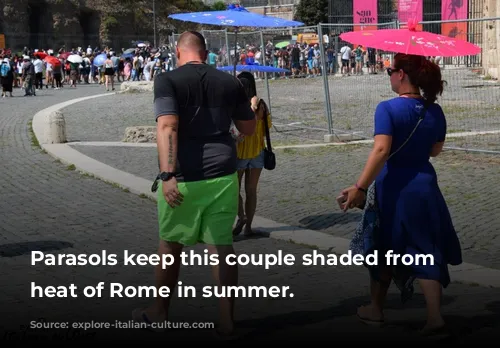 Parasols keep this couple shaded from the heat of Rome in summer.