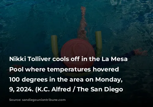 Nikki Tolliver cools off in the La Mesa Municipal Pool where temperatures hovered around 100 degrees in the area on Monday, Sept. 9, 2024.   (K.C. Alfred / The San Diego Union-Tribune)
