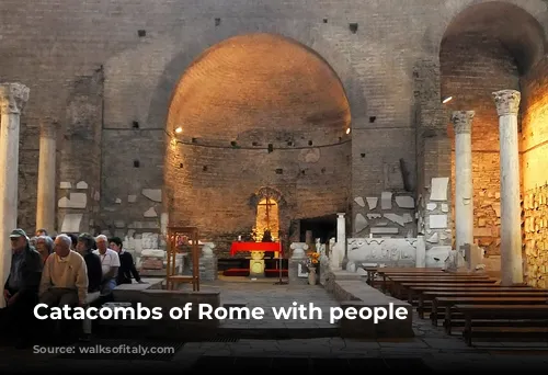 Catacombs of Rome with people