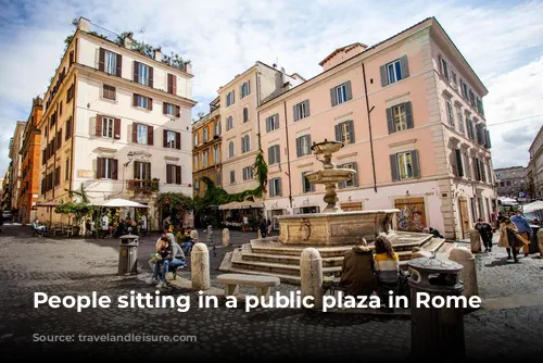 People sitting in a public plaza in Rome