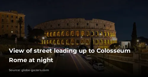 View of street leading up to Colosseum in Rome at night