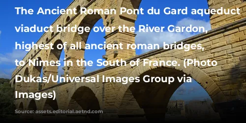 The Ancient Roman Pont du Gard aqueduct and viaduct bridge over the River Gardon, the highest of all ancient roman bridges, near to Nimes in the South of France. (Photo by: Dukas/Universal Images Group via Getty Images)