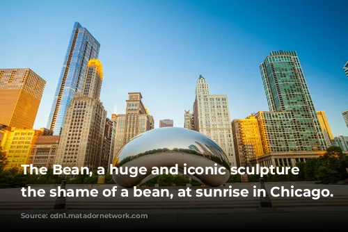 The Bean, a huge and iconic sculpture in the shame of a bean, at sunrise in Chicago.